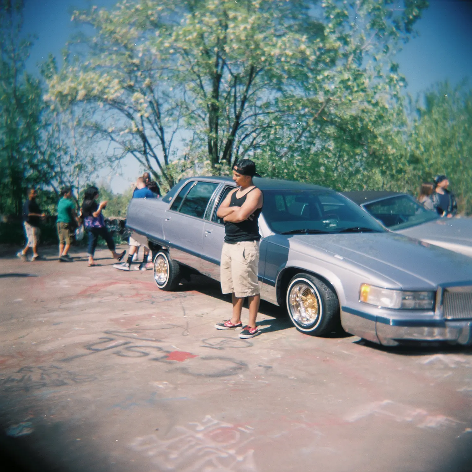 Man posses next to his low rider at the Fun Wall in Cleveland